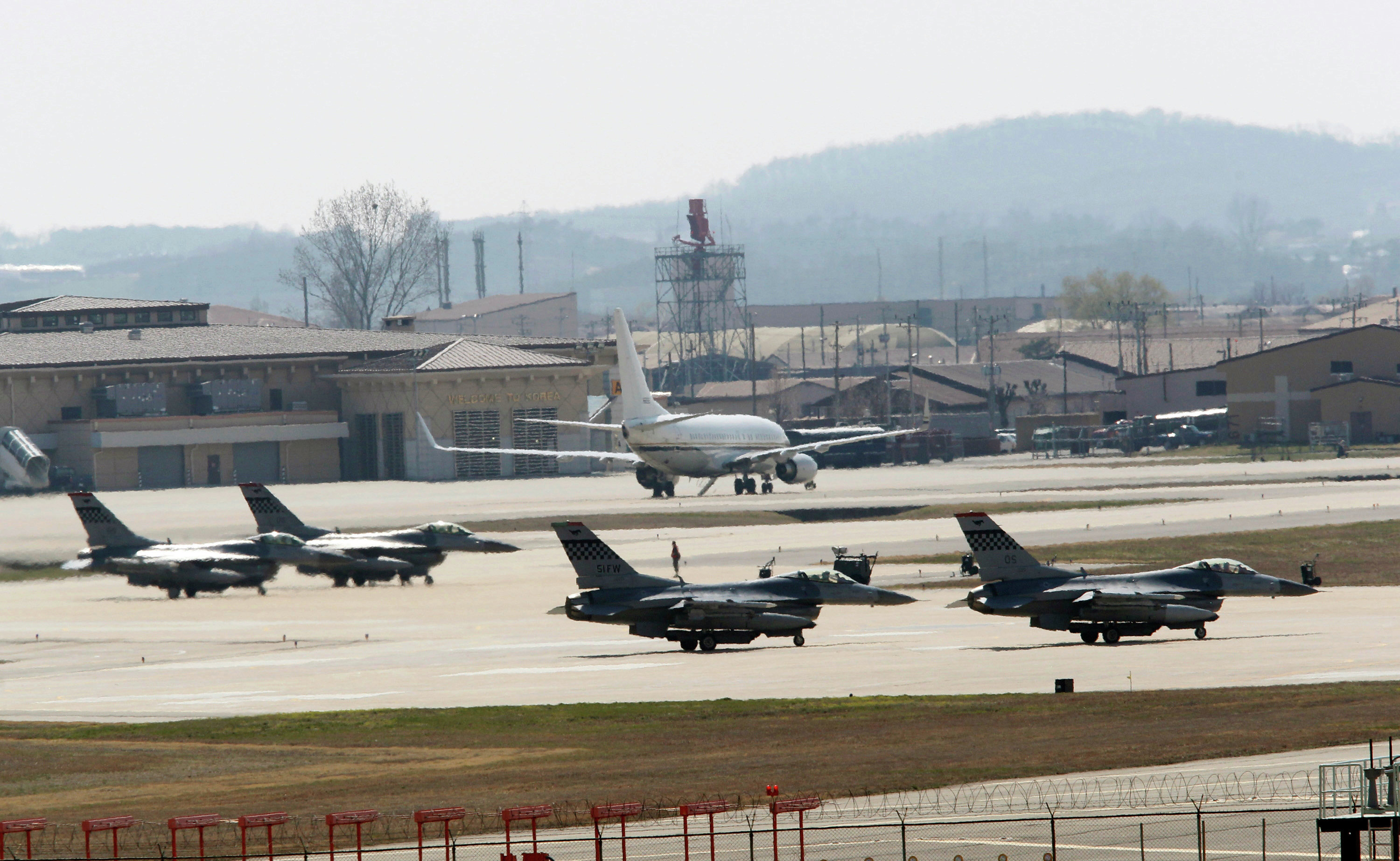 US Air Force F-16 fighter jets wait to take off from a runway during a military exercise at the Osan US Air Base in Osan, South Korea US Air Force F-16 fighter jets wait to take off from a runway during a military exercise at the Osan US Air Base in Osan, South Korea
